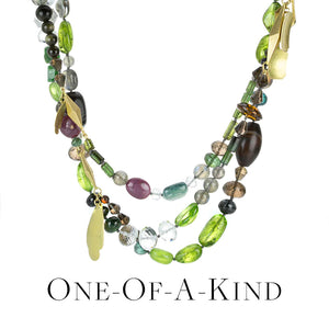 A one of a kind beaded necklace with multicolored gemstone beads; peridot, ruby, quartz, moonstone, sapphire and dangling 18k yellow gold elements by jewelry designer Gabriella Kiss. Link to the "one of a kind" collection