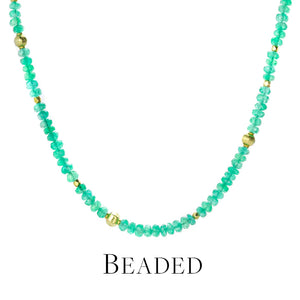 A beaded necklace with faceted, bright green emerald beads with faceted 18k yellow gold beads interspersed, handcrafted by jewelry designer Barbara Heinrich. Link to the beaded necklaces collection