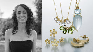 A black and white photograph of jewelry designer Nicole Landaw with carved 18k yellow gold flower studs with diamond centers, a chain with four prong set white sapphire pendants, a necklace with four prong set green sapphires, a pear shaped aquamarine pendant and a pair of crescent shaped gold hoops