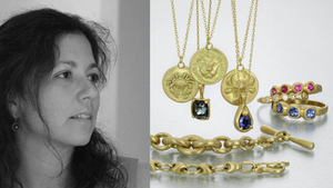 A black and white photograph of jewelry designer Marian Maurer alongside a collection of her handcrafted jewelry; three zodiac pendants featuring a carved crab, lion head and ox, a square blue tourmaline pendant necklace, a teardrop shaped pendant with a blue sapphire, two heavy gold link bracelets, a pink sapphire band, a diamond band and a blue sapphire band