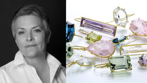 A black and white photograph of jewelry designer rosanne pugliese next to a pile of her gemstone earrings;, a long rectangular amethyst earring, a small, emerald cut lemon citrine earring, a pair of emerald cut green amethyst earrings, teardrop shaped pink morganite earrings