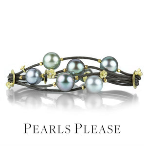 A multi strand brown nylon cord bracelet with 6 round gray Tahitian pearls, carved flower accent bead and tiny gold beads, handcrafted by jewelry designer Lene Vibe. Link to the "pearls, please" collection