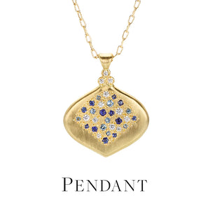 An 18k yellow gold necklace by the jewelry designer Adel Chefridi featuring a soft diamond shaped pendant with multicolored, faceted blue sapphires on a delicate chain. Link to the pendant necklaces collection