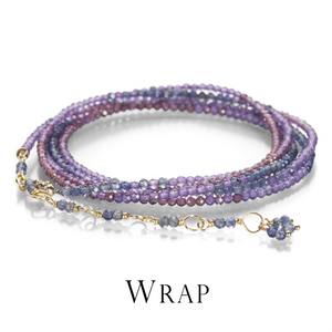 A wrap bracelet by jewelry designer Anne Sportun with small, round, faceted amethyst, garnet and iolite beads with a small wire wrapped section. Link to the wrap bracelet collection