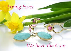 A pair of oval, turquoise earrings by jewelry designer Lola Brooks, a pair of pink sapphire winged gem bug studs in 18k yellow gold by jewelry designer Gabriella Kiss and a delicate gold bangle with a hot pink sapphire by jewelry designer Page Sargisson