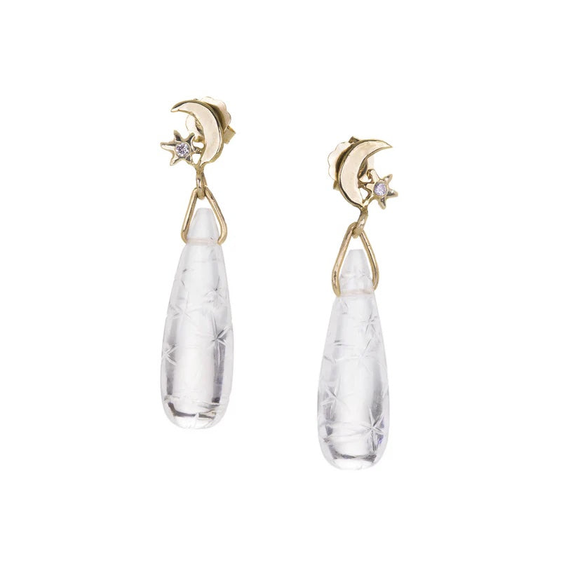 Pair of earrings with gold accents and clear teardrop-shaped stones on a white background