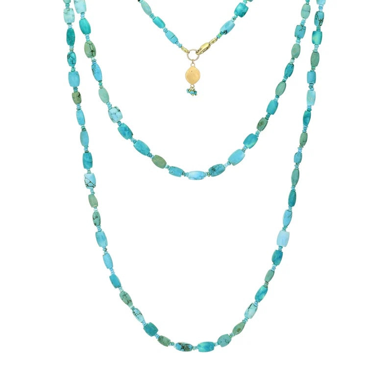 A double-strand turquoise and green beaded necklace with a small gold pendant, displayed against a solid white background.