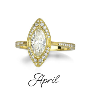 An 18k yellow gold ring with a marquise cut diamond center. Handcrafted by jewelry designer Erika Winters. 