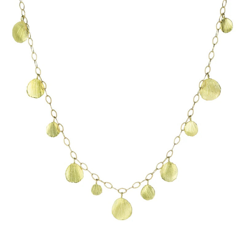 Gold necklace with leaf-shaped pendants on a white background