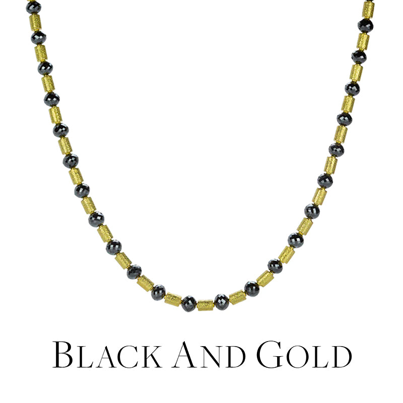 Necklace with black diamonds and gold beads on a white background
