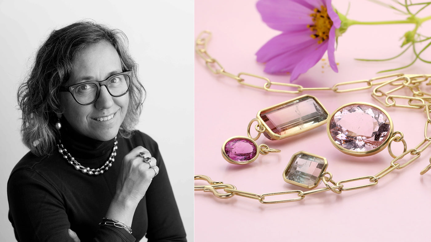 Woman wearing glasses and a black top with a side view of gold jewelry with pink gemstones on a pink background.
