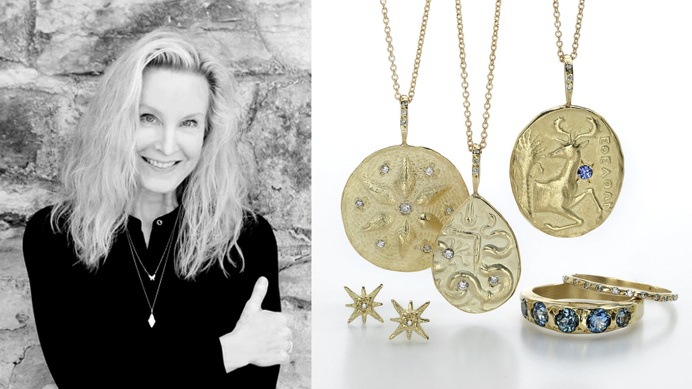 A black and white photograph of jewelry designer robin haley, a pair of small, 18k yellow gold starburst studs, a round disc pendant with a carved starburst design and diamonds, a teardrop pendant with a carved snake, an oval disc pendant with a blue sapphire and a carved stag, a thin delicate diamond band and a wide, hammered band with 5 round, faceted blue sapphires