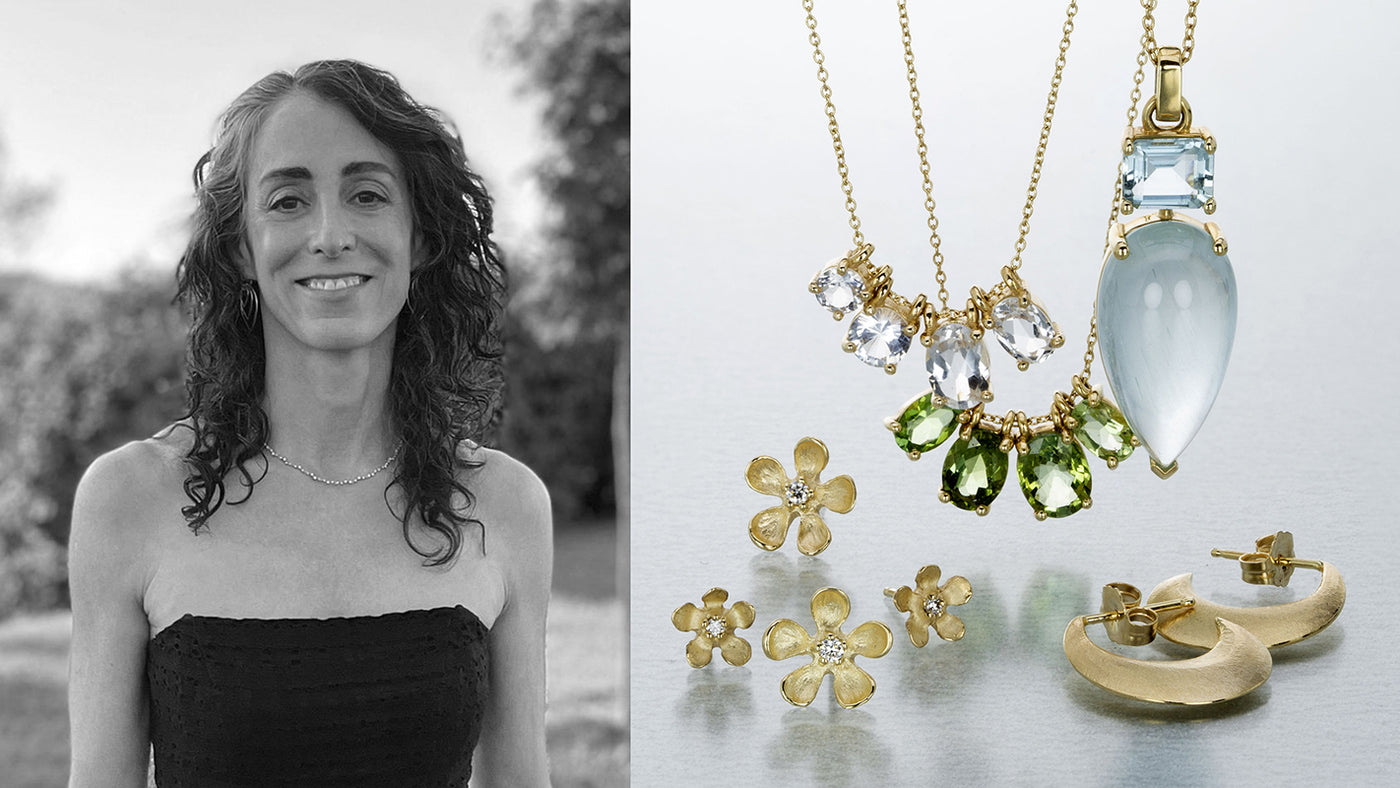 A black and white photograph of jewelry designer Nicole Landaw with carved 18k yellow gold flower studs with diamond centers, a chain with four prong set white sapphire pendants, a necklace with four prong set green sapphires, a pear shaped aquamarine pendant and a pair of crescent shaped gold hoops