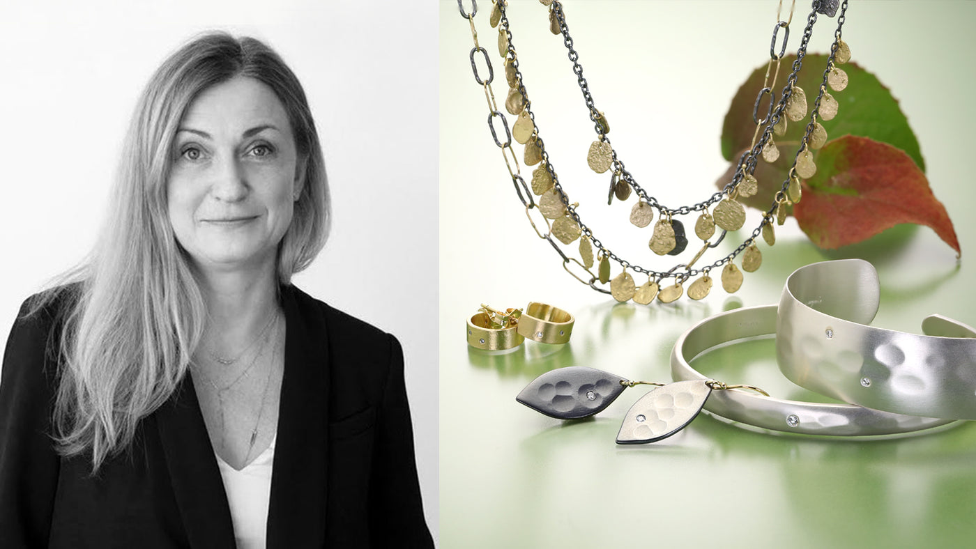 Woman next to jewelry display with necklaces, rings, and a cup on a white background