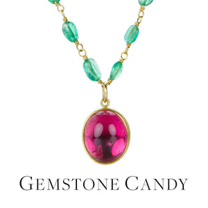 A wire wrapped emerald beaded necklace with a bezel set oval bright pink tourmaline pendant, handcrafted by jewelry designer Mallary Marks. Link to the "gemstone candy" collection