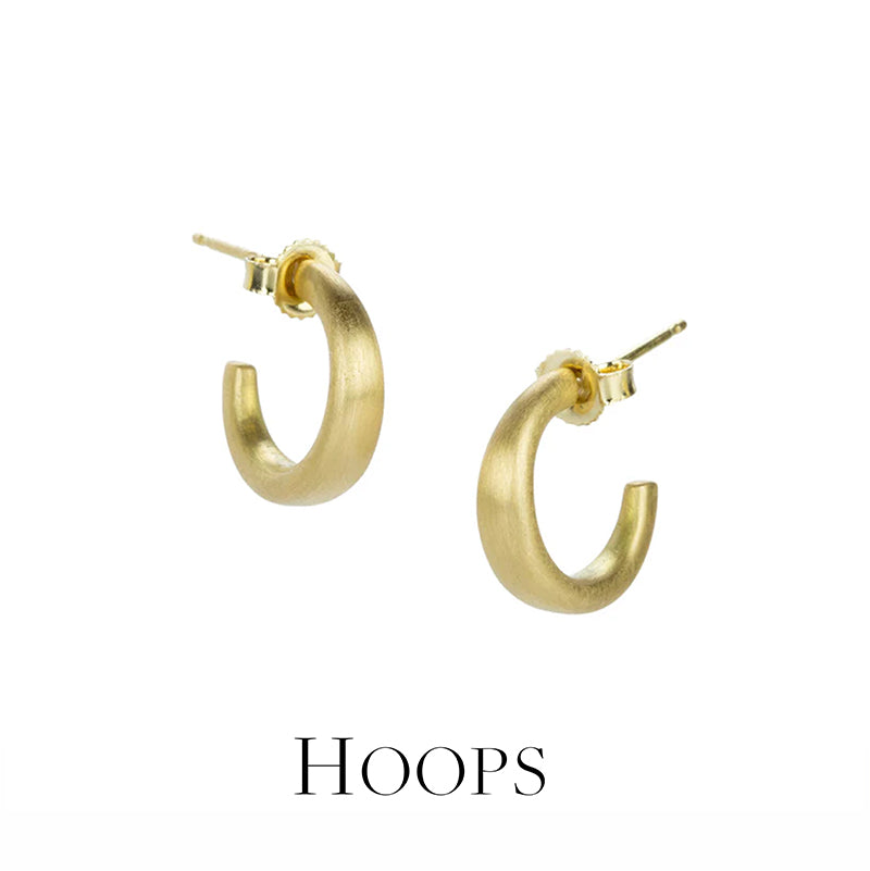 Gold hoop earrings on a white background with 'HOOPS' text below.