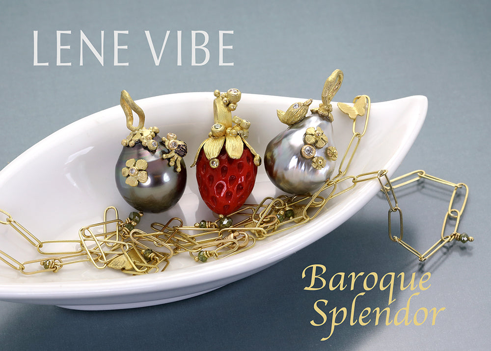 Jewelry set with baroque pearls and gold accents on a white dish, branded 'Lene Vibe'.