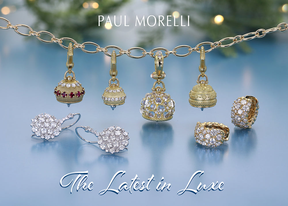 Jewelry set with charms and earrings on a blue background, featuring 'Paul Morelli'.