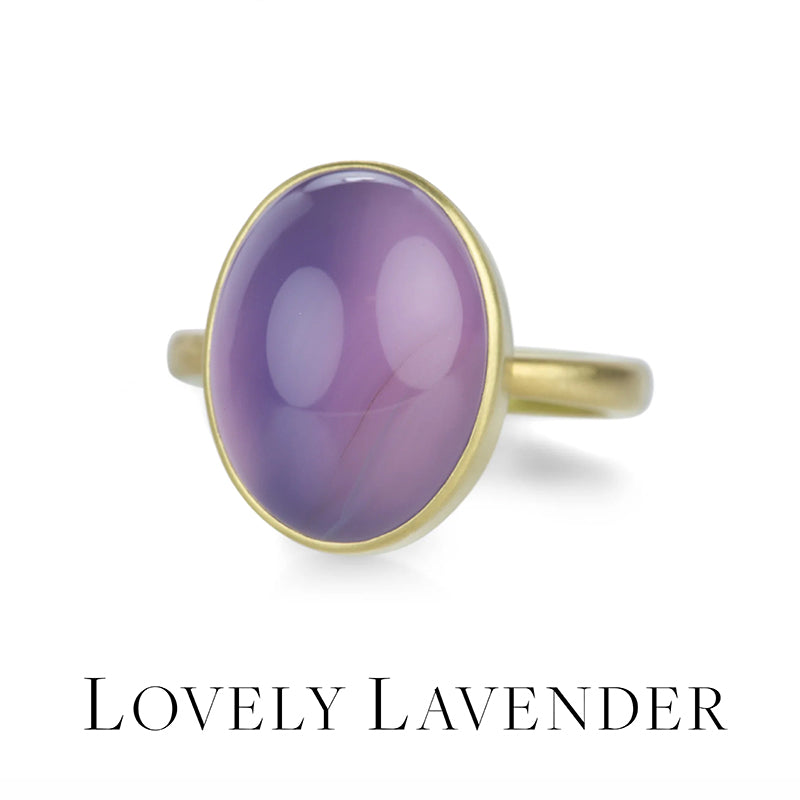 Gold ring with a purple gemstone on a white background, labeled 'Lovely Lavender'.