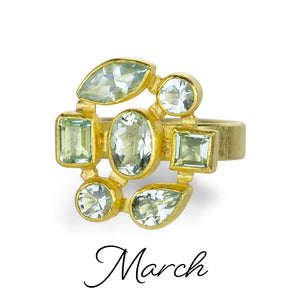 A 22k yellow gold ring with 7 faceted bezel set aquamarines. Handcrafted by jewelry designer Petra Class. 