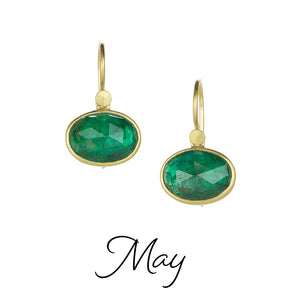 Gold earrings with green gemstones on a white background, labeled 'May'.