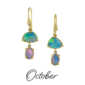 A pair of 18k yellow gold earrings, each with two, prong set, asymmetrical opal drops. Handcrafted by jewelry designer Annie Fensterstock. 