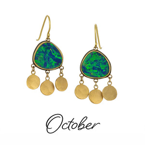 Gold earrings with green gemstones and gold discs on a white background, labeled 'October'.