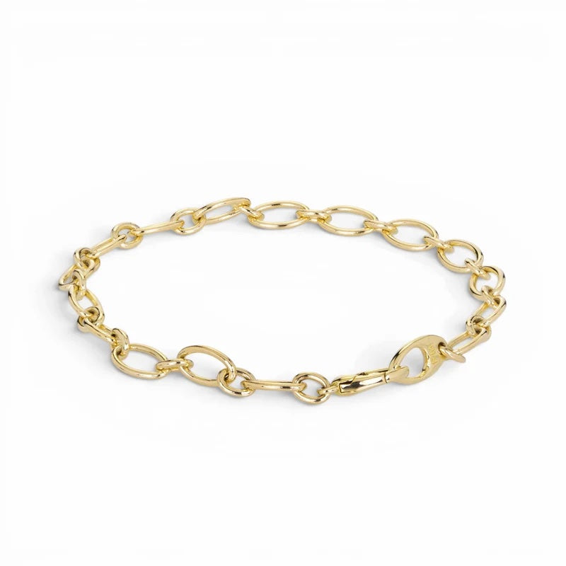 A gold chain bracelet with elongated oval links and a matching heart-shaped clasp, displayed on a clean white background.