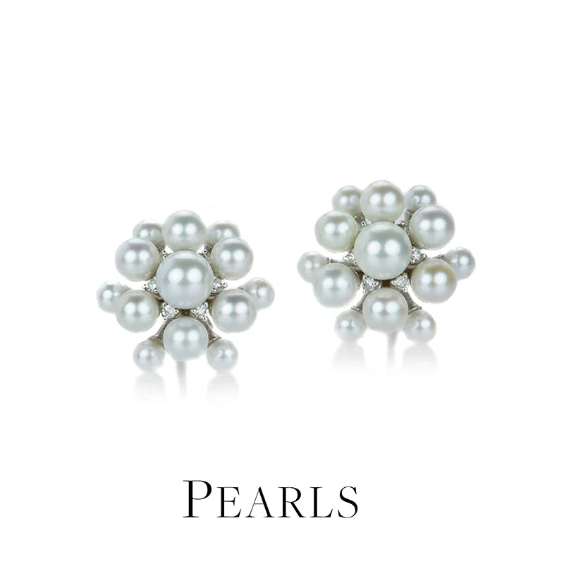 Pair of pearl earrings on a white background with 'PEARLS' text below.