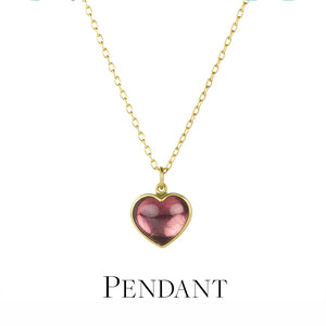 Heart-shaped pendant necklace with gold chain on a white background