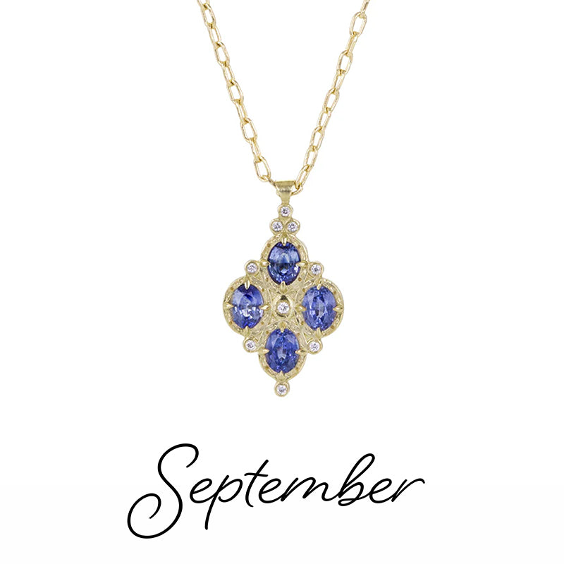 Gold necklace with a blue gemstone pendant on a white background, labeled 'September'.