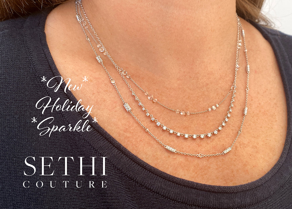 Necklace with 'Sethi Couture' branding on a person wearing a dark top.