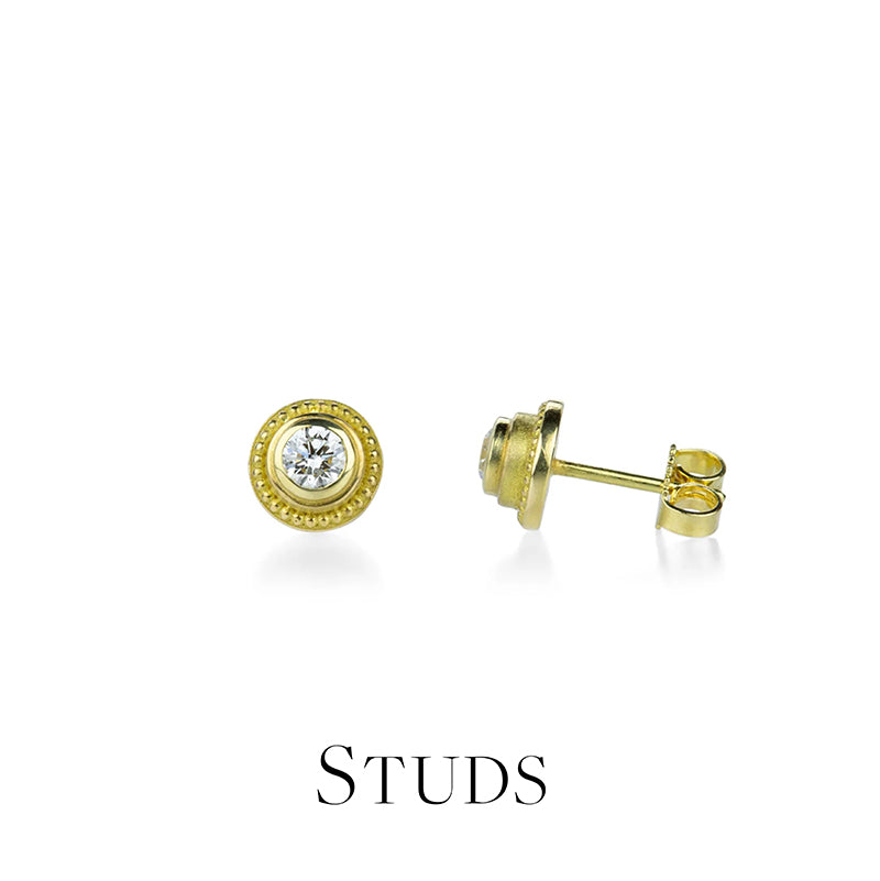 Gold stud earrings on a white background with 'STUDS' text below.