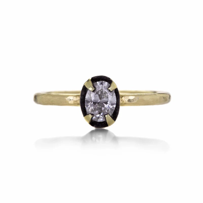 Gold ring with a diamond on a white background