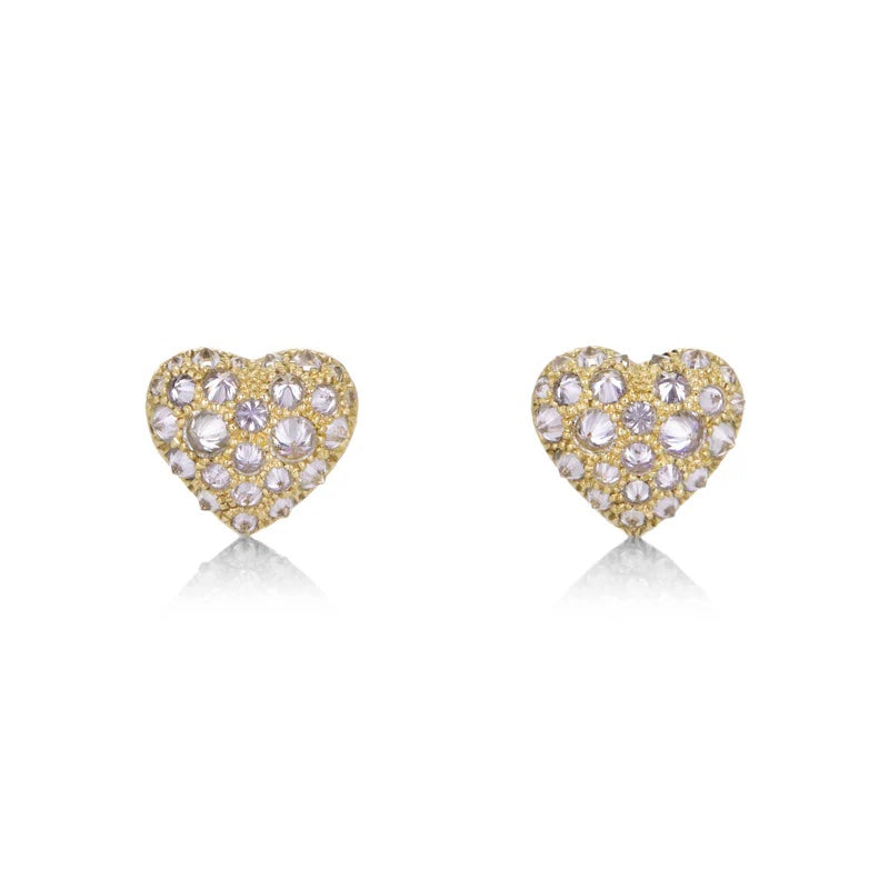 Heart-shaped earrings with gold and clear gemstones on a white background